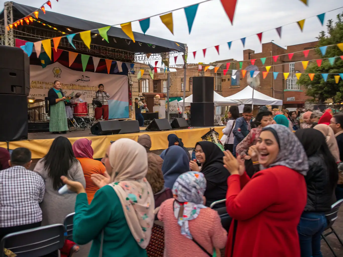 A photograph capturing a community event organized by En Compagnie des Cigales, showing people of all ages enjoying a cultural performance in a public space.